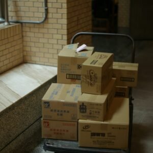 brown cardboard boxes on gray metal rack